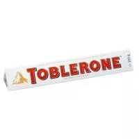 Фото акции TOBLERONE Шоколад бел.с мед/минд.нуг100г